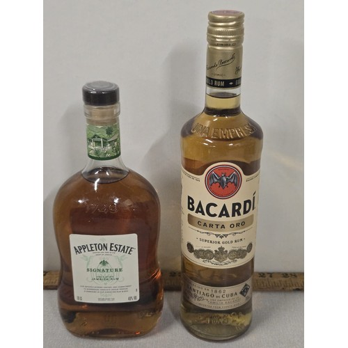 74 - 2 full & sealed bottles of rum to include Appleton estate signature blend along with Bacardi Carta O... 