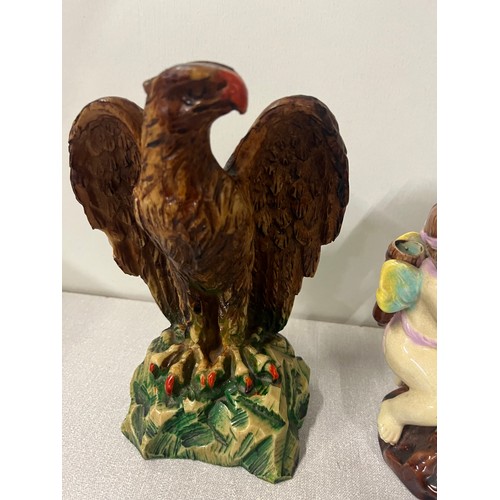 599 - Majolica spill vase with cherubs, 2 doulton miniature vase along with composite eagle