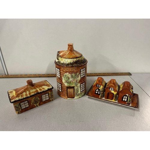 141 - 3 pieces of Price Kensington cottage ware to include butter dish, biscuit barrel & cruet set.