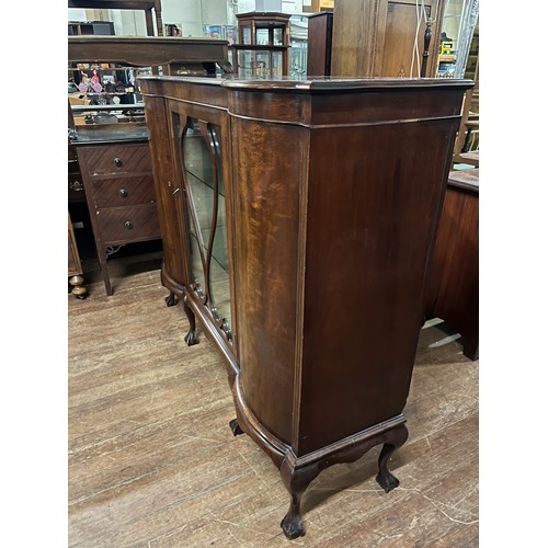 148 - Antique bow fronted 3 door display cabinet on ball claw feet, all doors open. 60