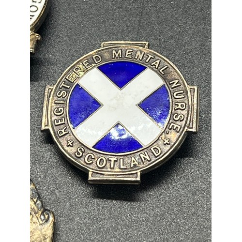 9 - 4 silver brooches to include 2 x Registered nurses Scotland and Hamilton & Inches Edinburgh