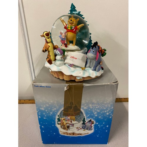 79 - Large Disney Store Poohs winter scene musical snow globe with box. 8.5