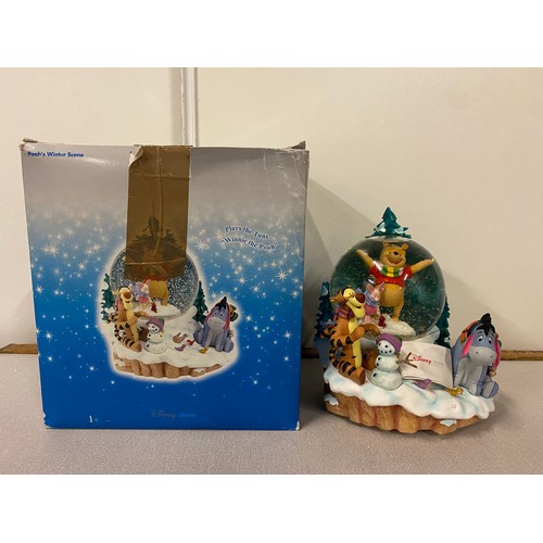 79 - Large Disney Store Poohs winter scene musical snow globe with box. 8.5