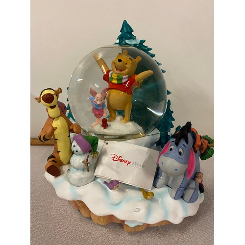 79 - Large Disney Store Poohs winter scene musical snow globe with box. 8.5