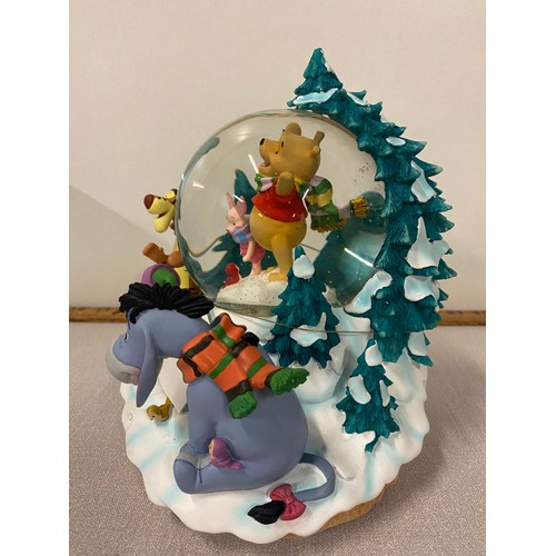 79 - Large Disney Store Poohs winter scene musical snow globe with box. 8.5