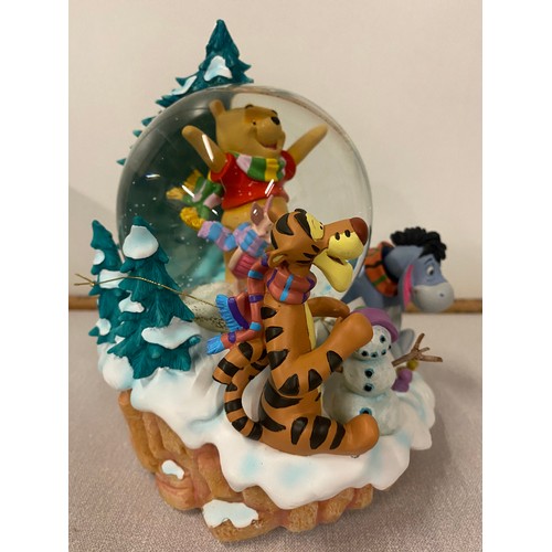 79 - Large Disney Store Poohs winter scene musical snow globe with box. 8.5