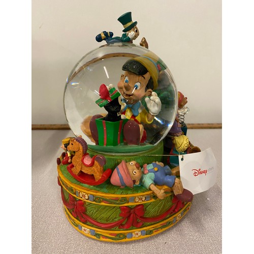 120 - Disney Store Pinocchio musical snow globe new with box. 8