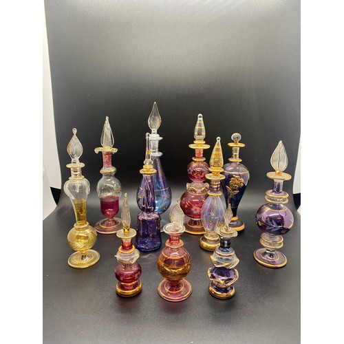 203 - Collection of 11 Egyptian hand blown glass scent bottles. tallest 7