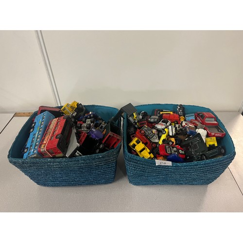 216 - 2 baskets full of playworn vehicles to include matchbox , corgi etc