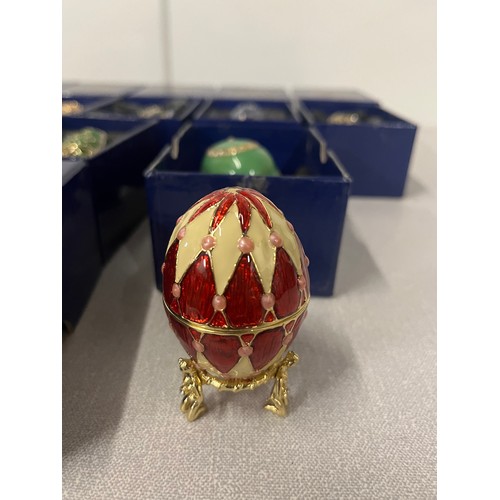 164 - 10 Atlas editions Faberge style decorative eggs with stands. (8 boxed)