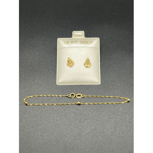 175 - A pair of 14ct gold earings along with 10kt gold bracelet