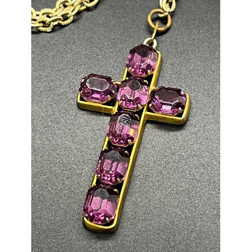 191 - Large metal cross set with ruby style stones on a white metal chain