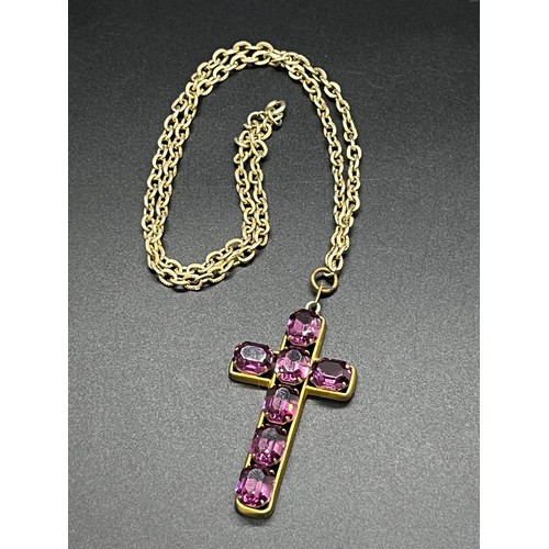 191 - Large metal cross set with ruby style stones on a white metal chain