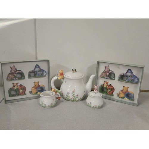 121 - Vintage Disney Simply Pooh teapot, sugar & creamer along with Disney Winnie the Pooh napkin rings.