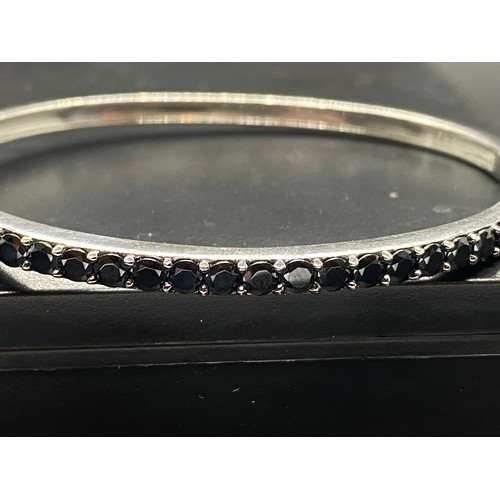 146 - Cif Jacobs sterling silver, 23 blacl cz stones hinged bangle. Fully hallmarked SJJ.