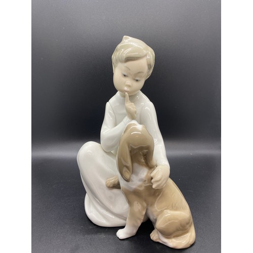 244 - Large Lladro boy with dog figure.