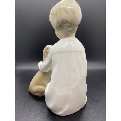 244 - Large Lladro boy with dog figure.