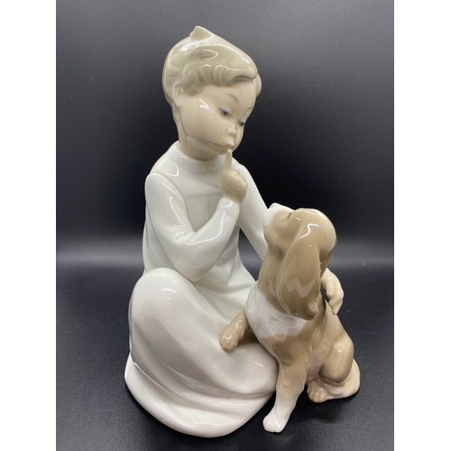 244 - Large Lladro boy with dog figure.