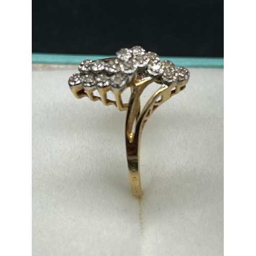 128 - 14k gold & diamond cluster ring