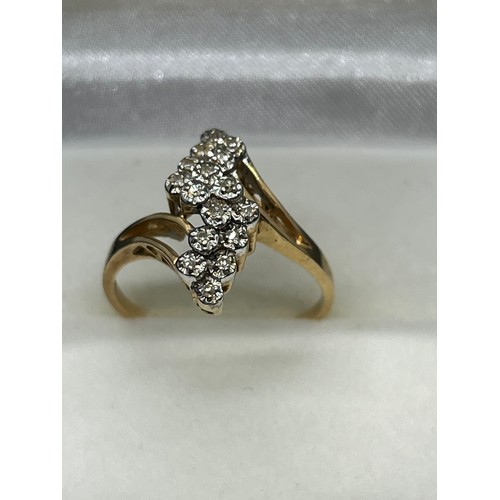 128 - 14k gold & diamond cluster ring