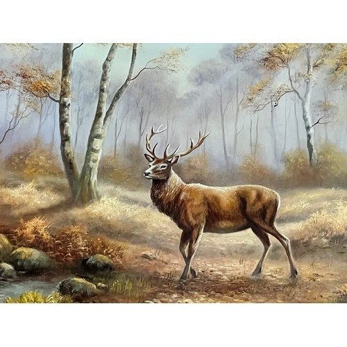 33 - A pair of large pine framed pictures of stags 22