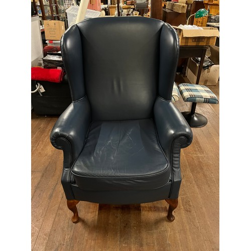 238 - Blue leather wingback arm chair.