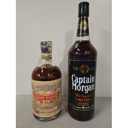 294 - Lt bottle of vintage Captain Morgan and 70cl bottle of Don Papa rum. Both full and sealed.