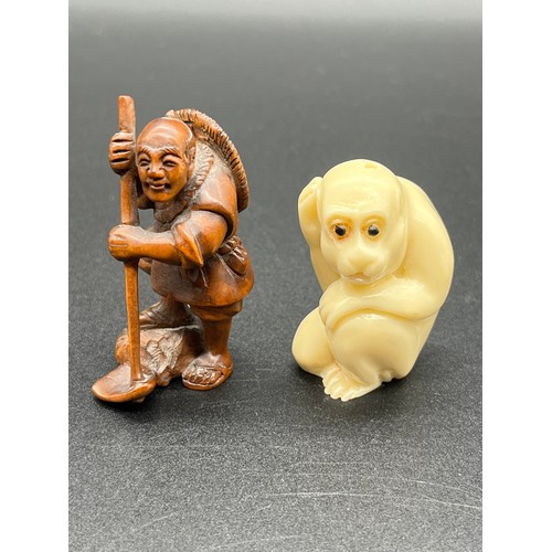 Bone netsuke of a snow monkey along with boxwood Japanese fisherman ...