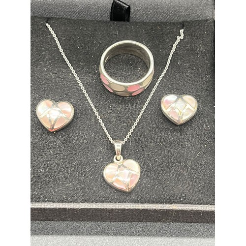 62 - Silver and mother of pearl heart shaped jewellery set to include pendant, chain, earrings and ring.