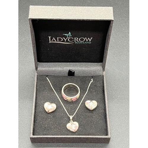 62 - Silver and mother of pearl heart shaped jewellery set to include pendant, chain, earrings and ring.