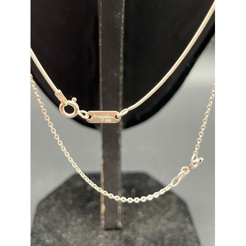 66 - 2 silver 925 oval pendants and chains to include amethyst and Whitby jet colour stones.