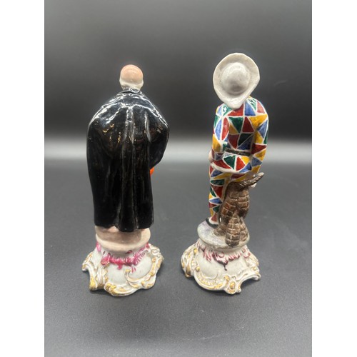 90 - A pair of antique chelsea pottery figures to include masked harlequin & masked figure with black coa... 