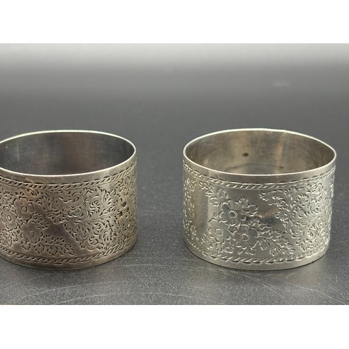 83 - Pair of London silver napkin rings along with Silver hand and horn blade Kris letter opener.