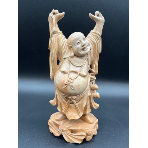 97 - 2 Japanese carved wood okimonos to include fisherman holding his catch and buddha tallest 10