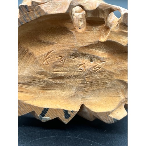 97 - 2 Japanese carved wood okimonos to include fisherman holding his catch and buddha tallest 10