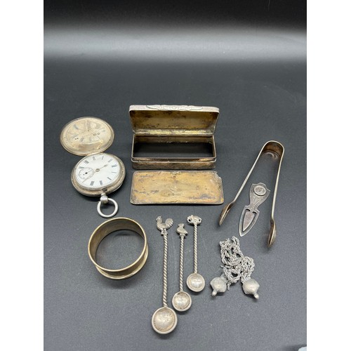 86 - Selection of silver items to include pocket watch, sugar tongs, napkin ring and Indian Rupee coin sp... 