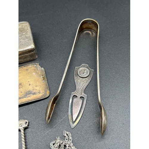86 - Selection of silver items to include pocket watch, sugar tongs, napkin ring and Indian Rupee coin sp... 