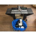 Trend router table along with bag of accessories for table.
