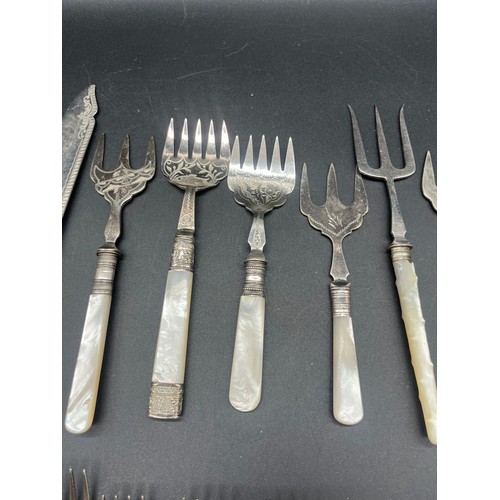 237 - Large collection of vintage mother of pearl handled cutlery.
