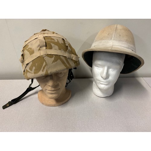 243 - British army desert DPM helmet along with a pith helmet.