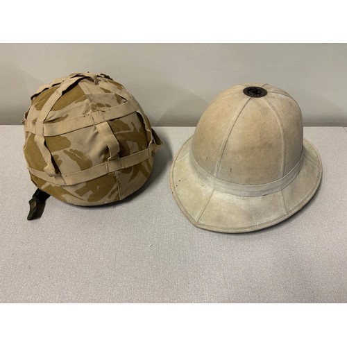 243 - British army desert DPM helmet along with a pith helmet.
