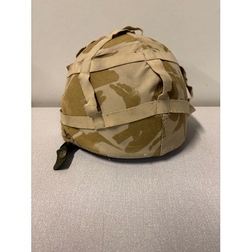 243 - British army desert DPM helmet along with a pith helmet.