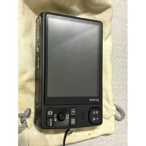 256 - Kodak M1033 digital camera along with pair of zoom binoculars.