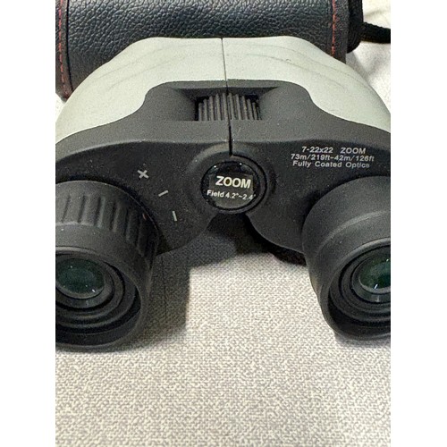 256 - Kodak M1033 digital camera along with pair of zoom binoculars.