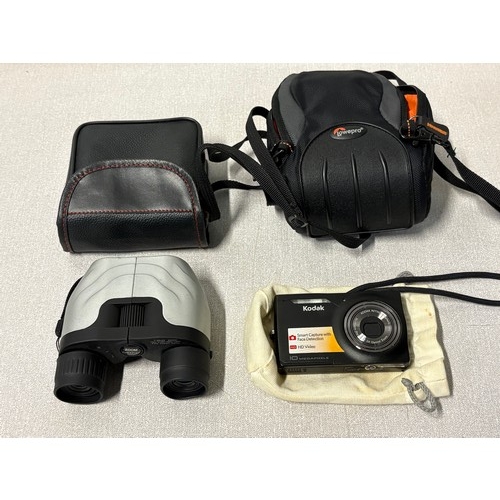256 - Kodak M1033 digital camera along with pair of zoom binoculars.
