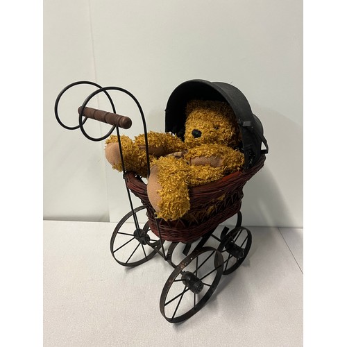258 - Vintage Victorian style wicker and metal doll pram along with German Sunkid teddy bear.