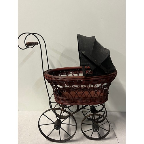 258 - Vintage Victorian style wicker and metal doll pram along with German Sunkid teddy bear.