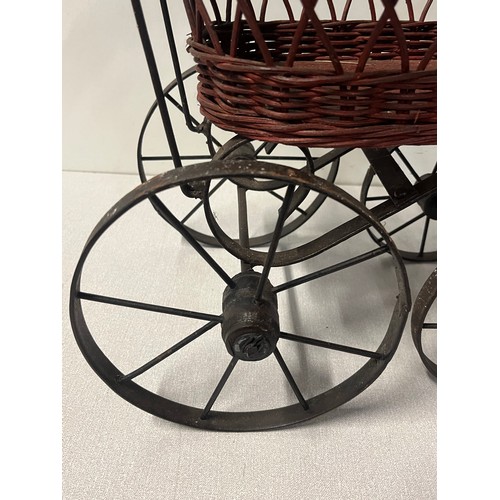 258 - Vintage Victorian style wicker and metal doll pram along with German Sunkid teddy bear.