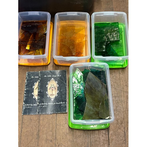 An assortment of stained glass supplies, glass and tools. Commonly used ...