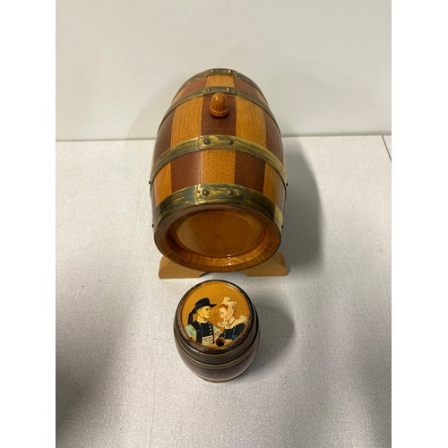 225A - Large oak and brass barrel on stand along with 1 other.